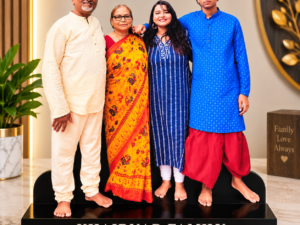 A customized family photo cut-out featuring four family members, displayed on a sleek black base with the family name in bold lettering.