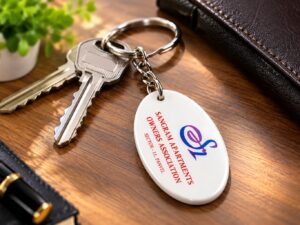 Oval clear acrylic keychain with custom logo printing, metal ring, and chain