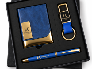 Personalized blue and gold corporate gift set with notebook, pen, and keychain