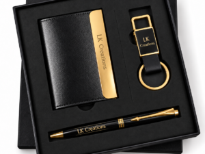 Black and gold personalized corporate gift set with pen and keychain in a presentation box