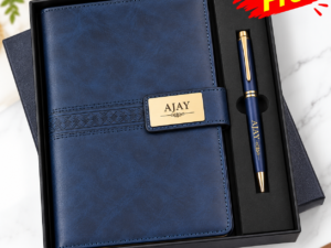 Blue pen beside a notebook from a personalized gift set