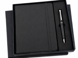 Black pen keychain with metallic clip and keyring, part of a personalized corporate gift set